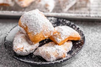 A dessert plate filled with beignets.