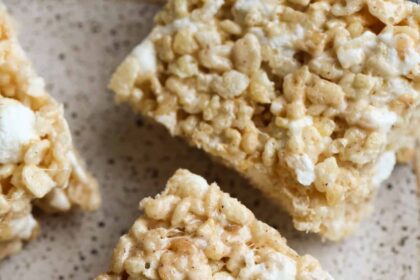 Pumpkin Spice Krispie Treats on a plate from above showing gooey marshmallow