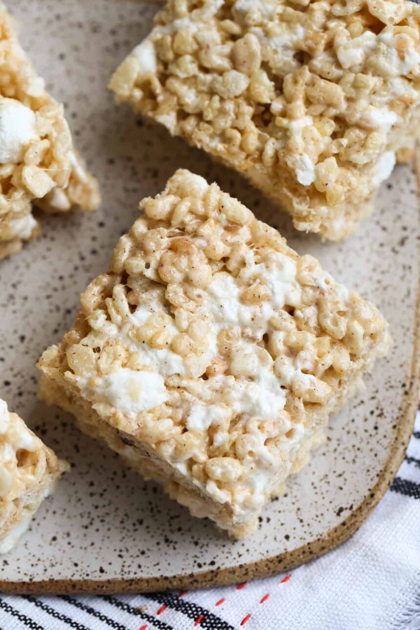 Pumpkin Spice Krispie Treats on a plate from above showing gooey marshmallow