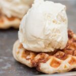 Cinnamon Roll waffle with a scoop of ice cream on it.