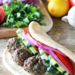 Lamb Meatball gyros on a wooden countertop