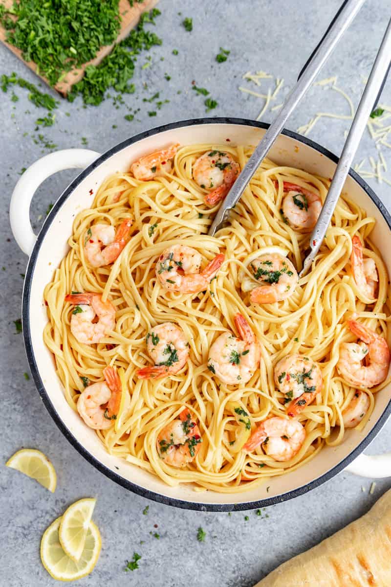 Looking into a large pot filled with shrimp linguine.