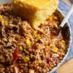 Chicken, pork, and beef stew with cornbread.