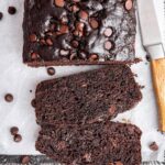 Two slices of chocolate zucchini bread on a large baking tray.