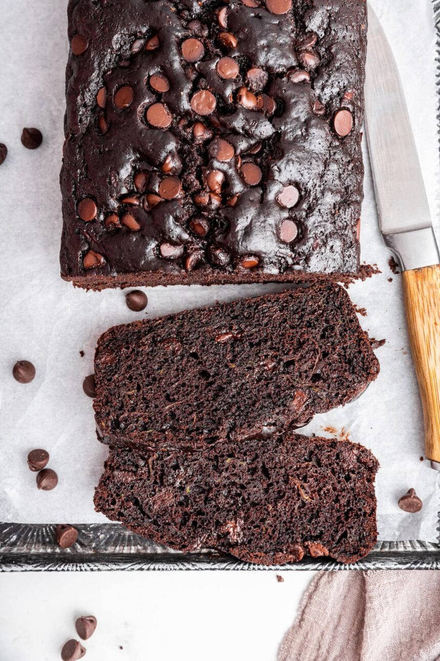 Two slices of chocolate zucchini bread on a large baking tray.