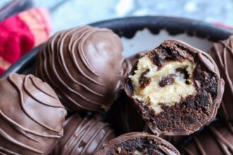 Brownie truffle filled with cookie dough broekn in half