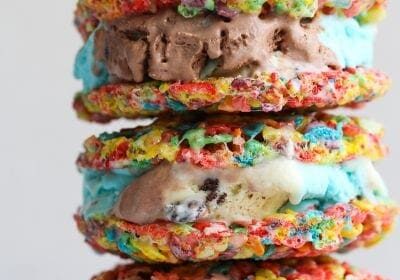 A stack of Fruity Pebble ice cream sandwiches on a plate