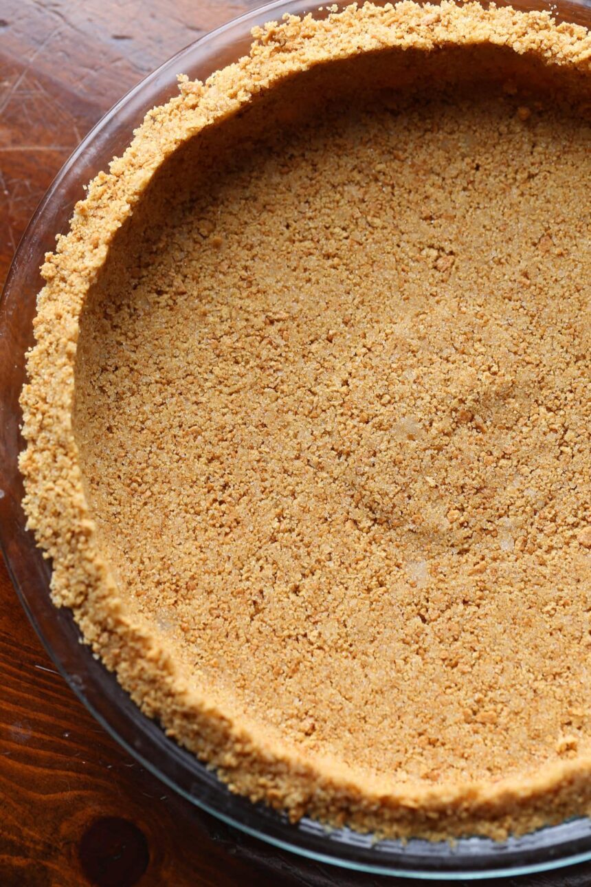 Graham cracker pie crust in a pie pan.