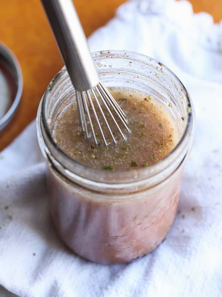 Greek Salad Dressing is an easy vinaigrette that is good on salads, sandwiches, or as a marinade!