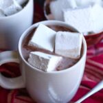 Three Homemade Marshmallows Floating in a Mug of Hot Chocolate