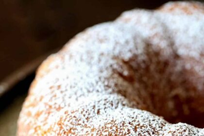 Kentucky Butter Cake on a platter dusted with powdered sugar