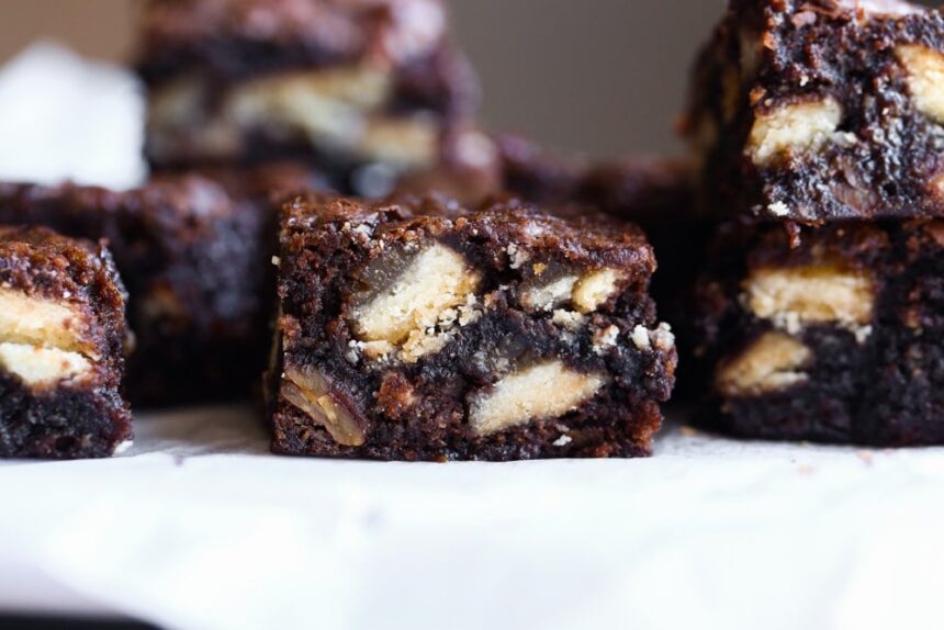 Cut brownies on a platter with pie crust baked inside