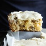 A slice of pineapple cake on a metal spatula