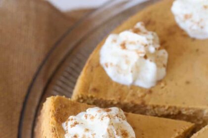 Sliced Pumpkin Cheesecake with whipped cream