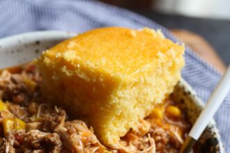 Chicken, pork, and beef stew with cornbread.