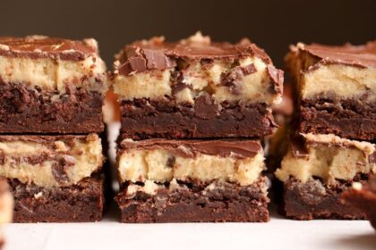Fudge Brownies topped with raw cookie dough and chocolate ganache