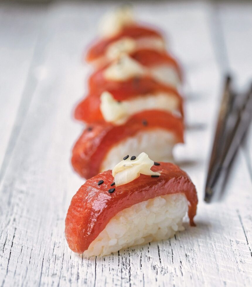 Cutting watermelon tuna sushi serving in wood plate