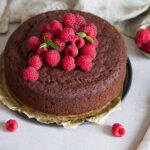 Vegan Gluten-Free Chocolate Sponge Cake Topped with Raspberries