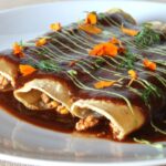 Tofu and Vegetable Enchiladas With Spicy Chili Sauce and Avocado Crema