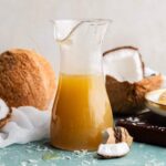 Coconut syrup in a pitcher.
