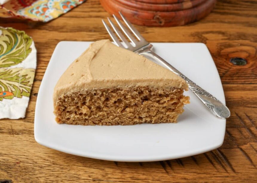 coffee cake with coffee frosting on a plate with a fork