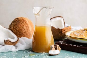 Coconut syrup in a pitcher.