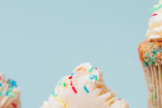 Photo showing the fluffy texture of the inside of our gluten-free funfetti cupcakes