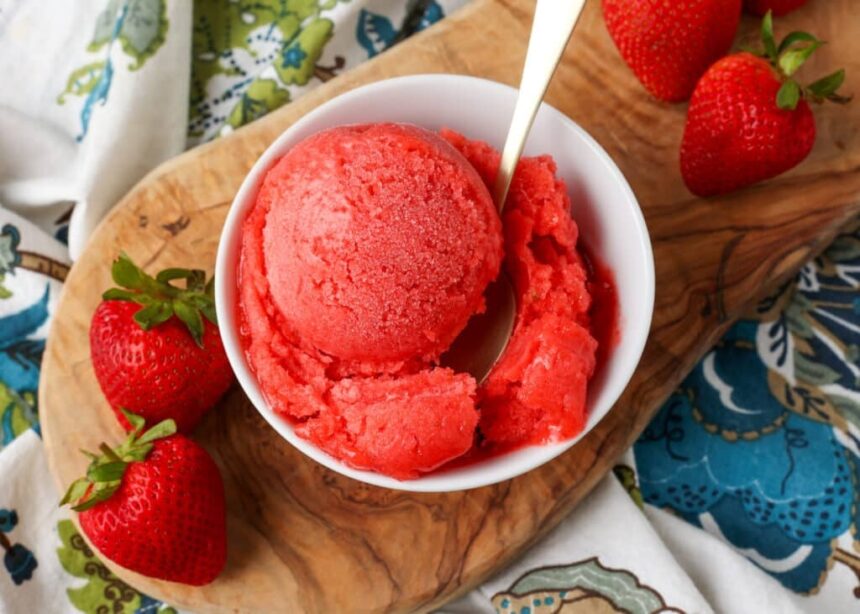 overhead shot of sorbet with strawberries on cutting board
