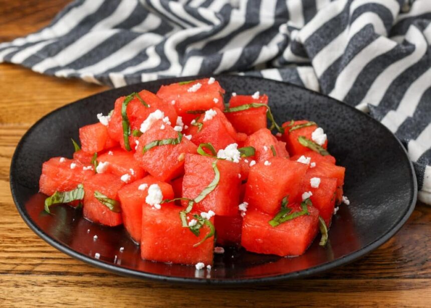 watermelon basil salad on a black plate