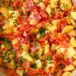 pot on stove with bacon and potatoes