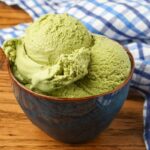 green tea ice cream in bowl bowl on wooden table