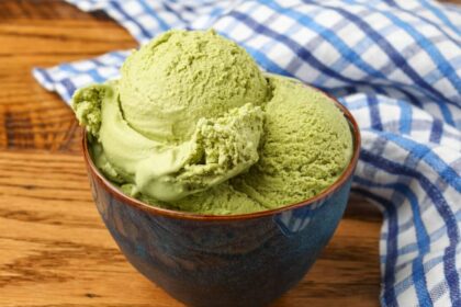 green tea ice cream in bowl bowl on wooden table