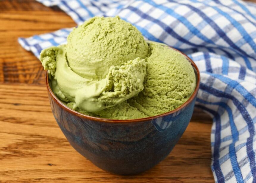 green tea ice cream in bowl bowl on wooden table