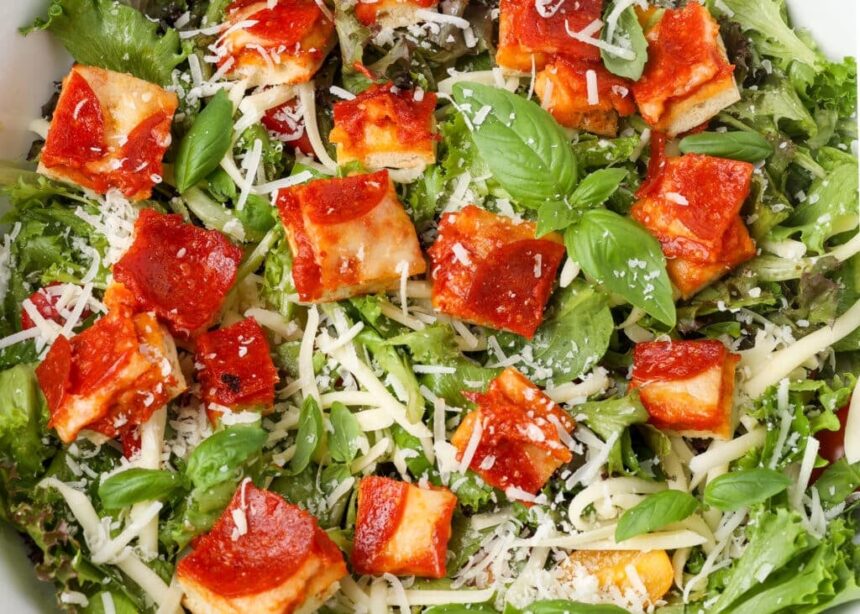close up horizontal photo of salad with pizza croutons