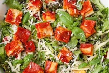 close up horizontal photo of salad with pizza croutons