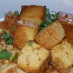 Crispy Tofu Over Thai Peanut Udon Noodles [Vegan] – One Green Planet
