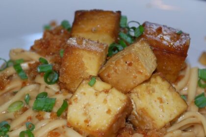 Crispy Tofu Over Thai Peanut Udon Noodles [Vegan] – One Green Planet