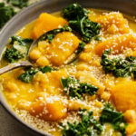 Spoon resting in a bowl of our 1-Pot Kabocha Chickpea Miso Soup