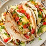 A plateful of loaded Pineapple Chicken Tacos, just begging to be devoured.