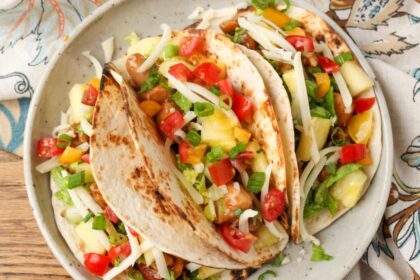 A plateful of loaded Pineapple Chicken Tacos, just begging to be devoured.