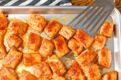 salmon bites with spatula on sheet pan