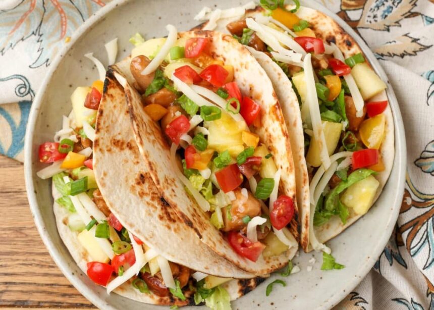 A plateful of loaded Pineapple Chicken Tacos, just begging to be devoured.