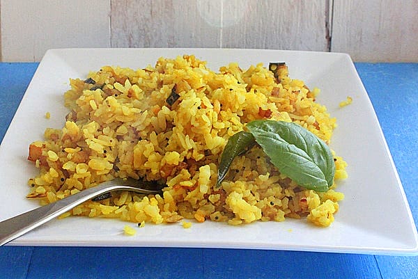 Indian Flattened Rice Flakes Cooked with Veggies and Nuts [Vegan] – One Green Planet