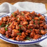 A horizontally aligned photo of a plate full of crispy, juicy southwest chicken bites.